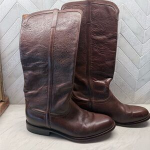 Lucchese embossed woman’s riding boots.
